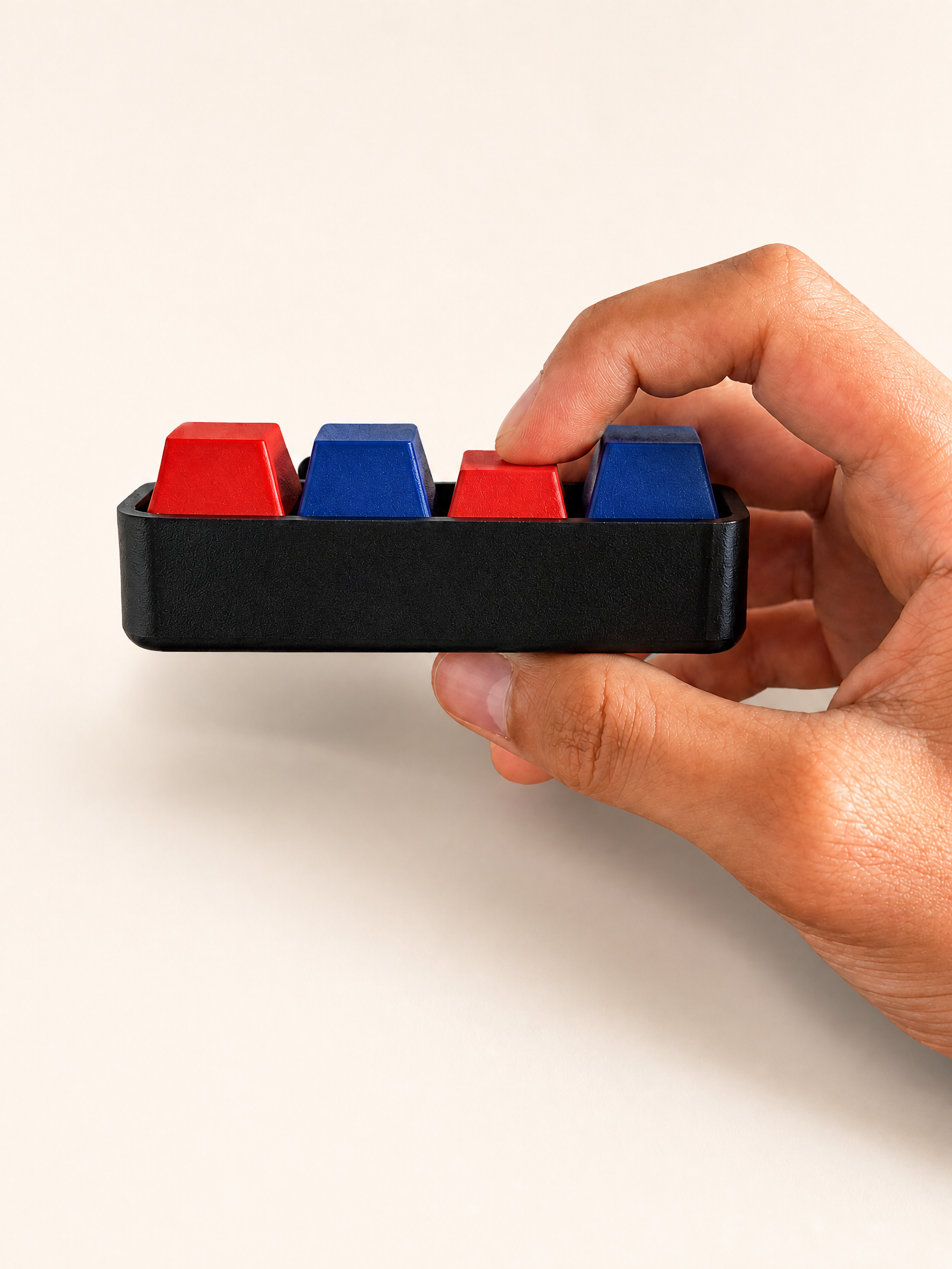 4 Key Clicker held in hand