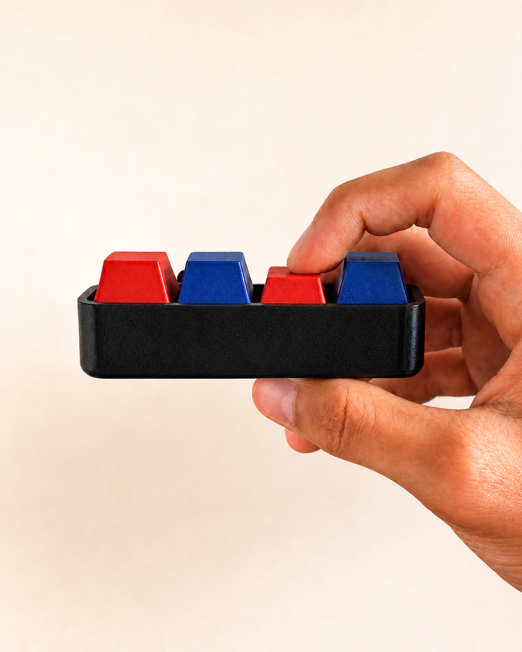 4 Key Clicker held in hand